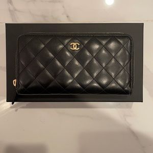 CHANEL
Lambskin Quilted Large Gusset Zip Around Wallet Black with gold hardware